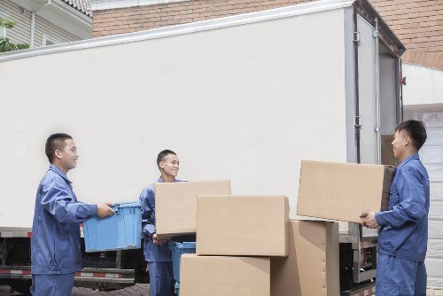 Professional house removals in Upton with packed moving boxes